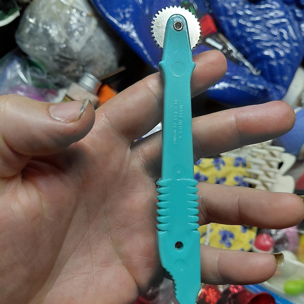 Dritz serrated tracing wheel used for sewing and pattern making.